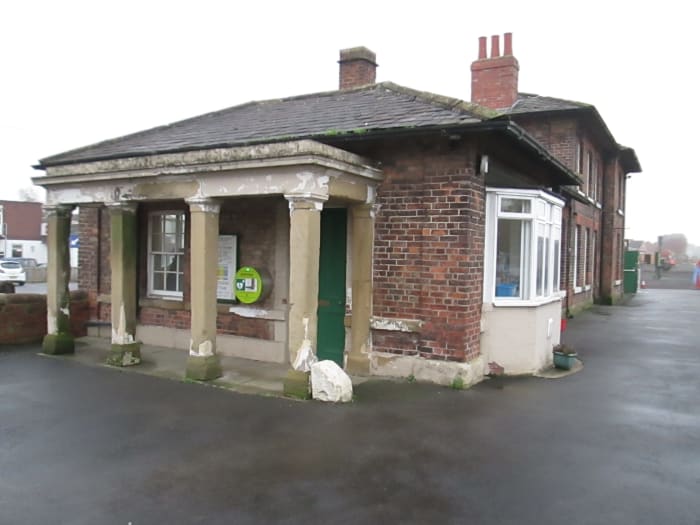 Leeming Bar Station buildings on the Wensleydale Railway with the handsome portico that faces onto the road north away from the roundabout.
