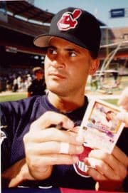 Former Cleveland Indians player Omar Vizquel wearing a baseball cap showing the image of the Cleveland Indians mascot, Chief Wahoo