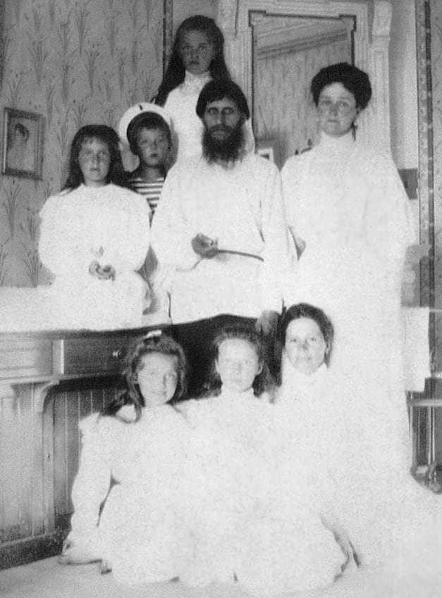 Rasputin with Alexandra and all of her children, Alexie is to the left of Rasputin.
