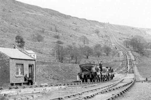 Steel-bodied mineral wagons begin haulage to the top with 'passengers' - although against the rules operators turned a blind eye. There was no passenger service and beyond Blakey there was only the brake van to ride in to Rosedale (ca 1900) See below