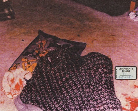 Devon's covered up body with what appears to be a towel next to it. The blood on the towel was Darlie's, and no water was found on the towel.