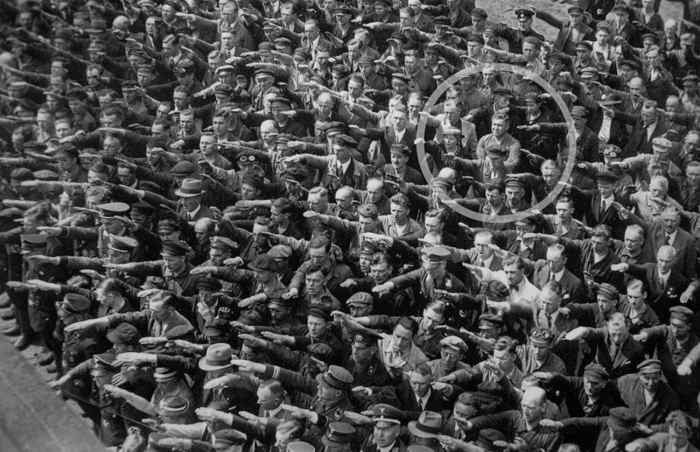 The man who didn’t salute Hitler. A German man standing at a rally in 1936. Hamburg, refuses to give the Nazi salute. The photo laid unnoticed for nearly 55 years