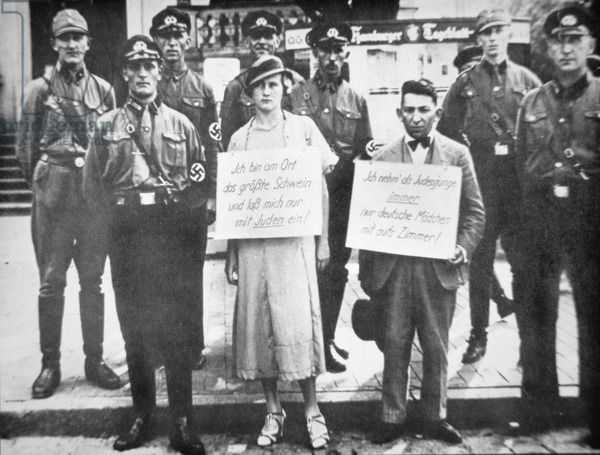 15 Sep Nuremberg Laws deprive German Jews of citizenship. This is an image of Nazi police publicly humiliating and shaming a German woman and a Jewish man for sleeping together.