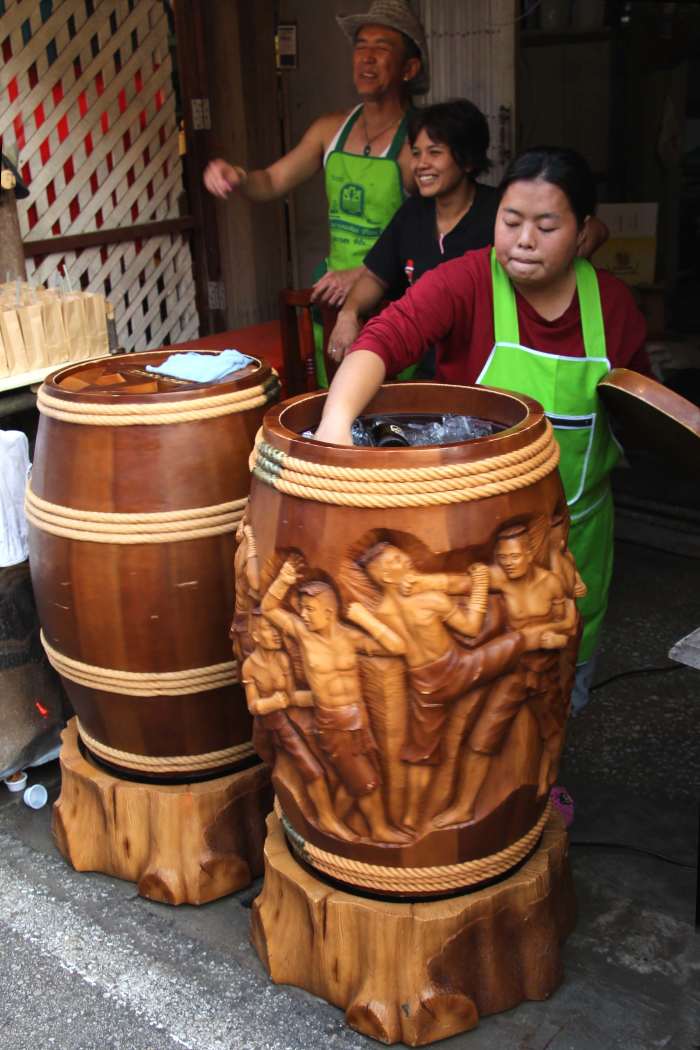 These ornately carved wooden barrels are a feature of the street. Bottles of drink are placed into the barrel which is packed with ice and water and salt, and gently rotated to keep them as cool as possible