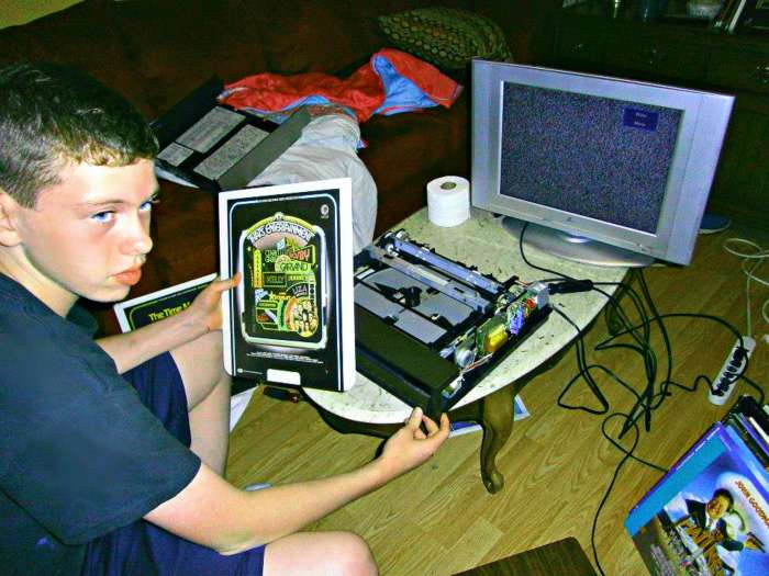 Grantley Waters repairing another Selectavision player, he fixed a laser disc player yesterday, and now he is working on this RCA Selectavison model. He has turned the living room into his repair shop. A good and productive way to spend a Summer.