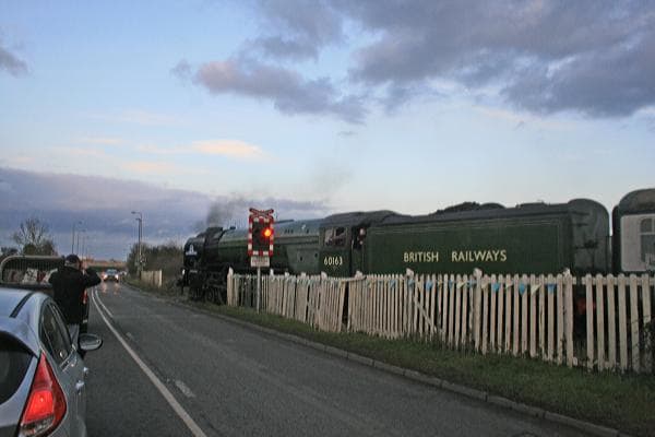 Tornado' trundles onto Aiskew Crossing (with the warning lights flashing) on her way between Leeming Bar and Bedale with a train for Redmire