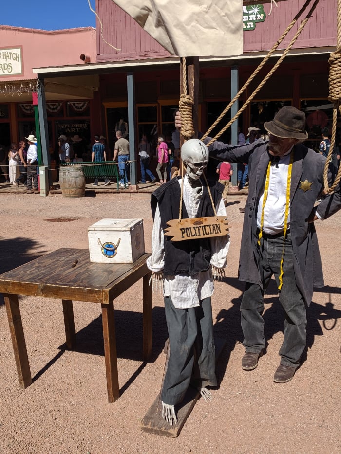 For a $5 Contribution to a Tombstone charity one can have their picture taken being hung along with a politician