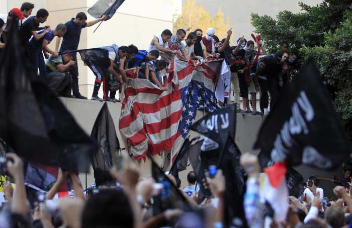 Egyptian protesters tearing down the United States flag at the American Embassy in Cairo on Sept.11, 2012, during a demonstration against “Innocence of Muslims,” a video offensive to Islam.