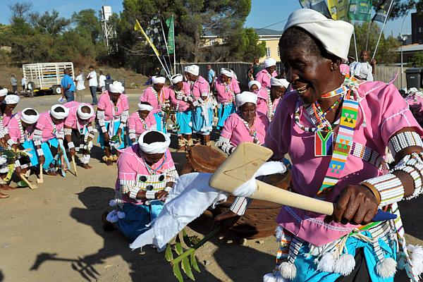 Bapedi women dressed in ceremonial.cultural garb, and performing their sacred rites and practices, through music and dance