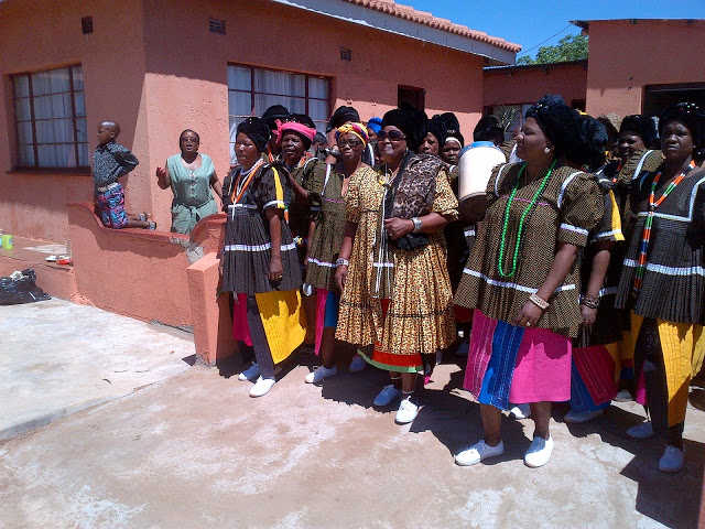 Royal Highness accompanied by her sister in laws, in sepedi 'ke di ngwetshi'-they are married women. They all dressed in the same attire.