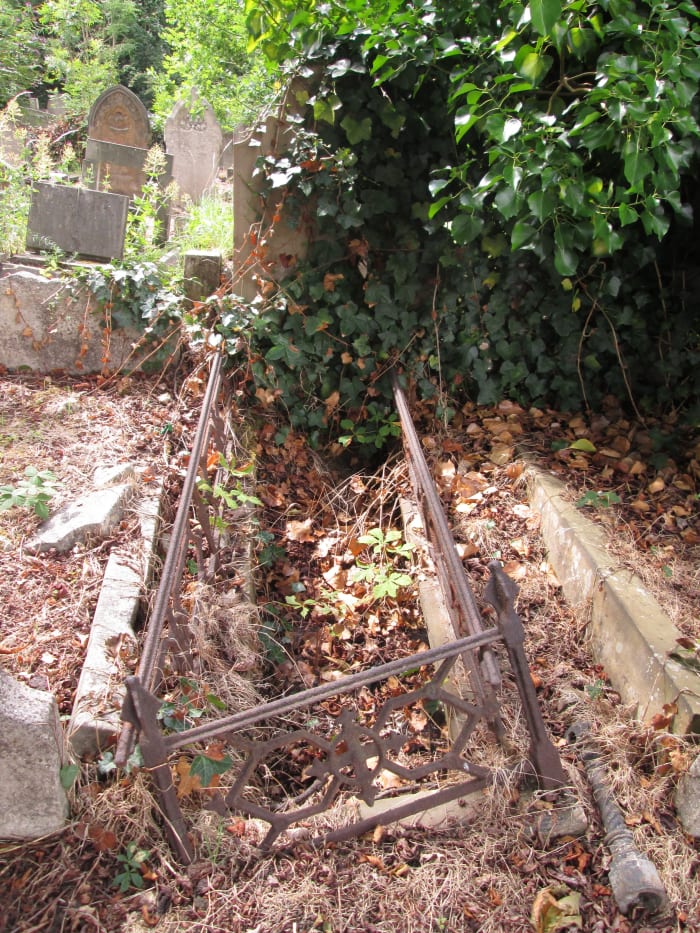 ... The stone memorial lies flat, the iron railings rusted, the top has been removed - it's said at times satanists enter these grounds as well as the City of London Cemetery not far away to the north of Newham