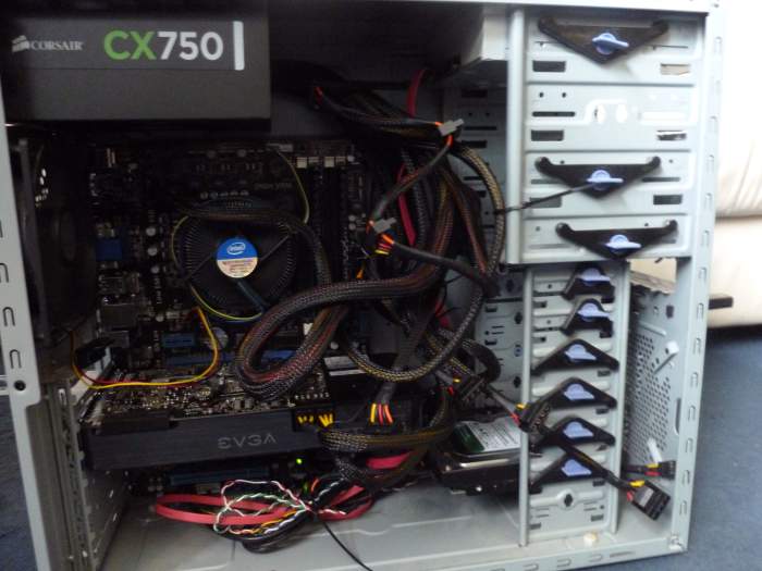 The inside of a desktop computer. The processor, graphics card, RAM, hard drive and everything else neatly fitted together via the motherboard.
