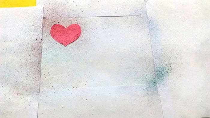 Cover the margin with regular papers and use paper cutouts of your choice. Here I have used a Heart.