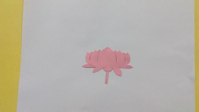 Let us use a flower cutout for spraying. Draw a lotus on a paper and then cut it out from the paper.