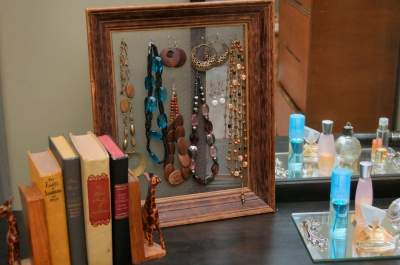 A beautiful accent - unpainted and without any fabric backing, I made hooks from paper clips to hang necklaces on.