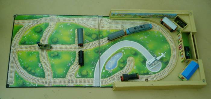 Wellsworth Station Playset- has three different colored roofs for the buildings in which to store the trains. A blue (shown), red and green roof are included with the set.