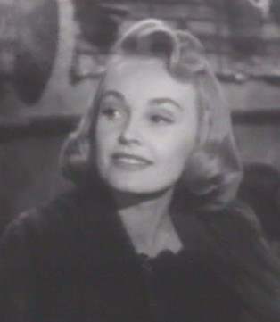 Here's Virginia Lee with hair that ends at her jaw, which would normally be a hair-don't for women with squarish jaws. But two things save her: the sleek, soft look of the waves and the delicacy of her well-defined features.