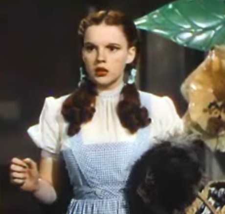 Judy Garland's face doesn't look very long in the Wizard of Oz. With a close-cropped style around her head, her braids fluff out over her chest--this makes her face look round, like that of the young girl she's playing.