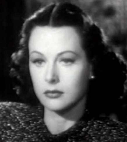 Hedy Lamarr wears a style that broadens at the base of her jaw, rounding out a long thin face shape and making it look more heart-shaped.