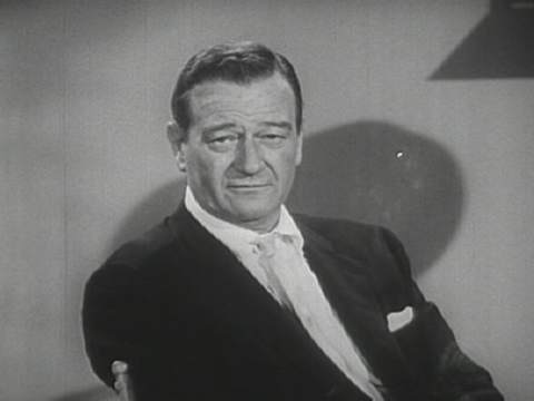 John Wayne's square-shaped face is perfectly acceptable in a guy--in fact, his boxy hairstyle made the most of it.