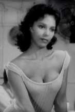 Dorothy Dandridge with a round or heart-shaped face--it's hard to tell--made even more heart-shaped by the fluffing out at her neck.