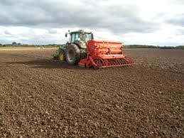 Here we have a wheat sowing machine and tractor sowing a field. All these machines together help the farmers to produce cheap wheat and all other sort of grains.