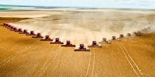 Show off of Harvester machines and how harvesting is done today. But here we have to say that this photo is just an exaggeration because it is too crowded with machines. Anyhow, harvesting was a lot harder in the old times.