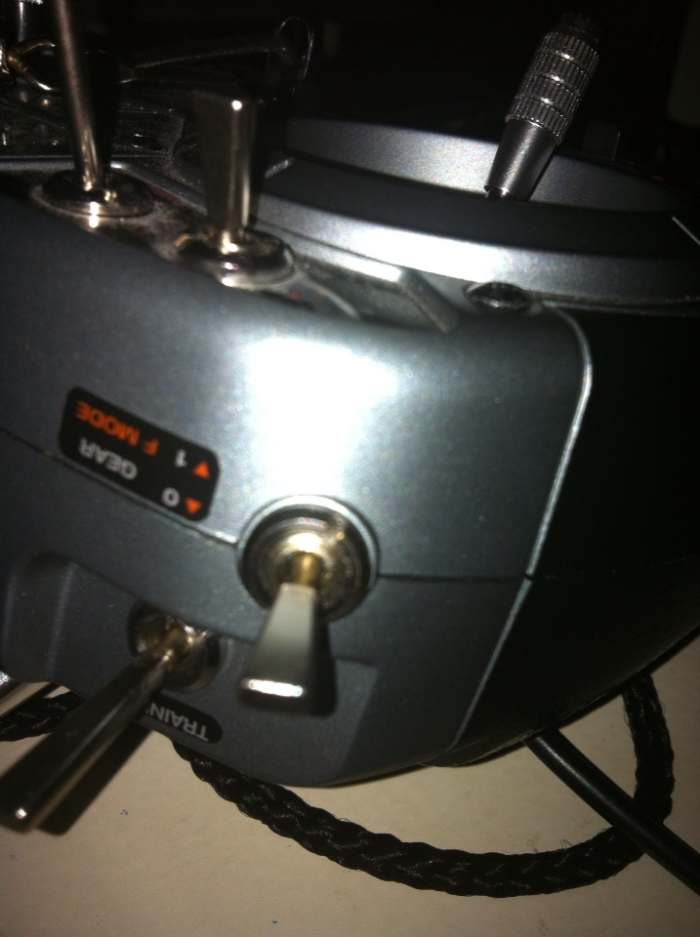 On the Spektrum DX6i, the F-Mode switch it on the left front face of the transmitter. It says "Gear / F Mode." When the switch is down, Flight Mode is OFF. Flip the switch up and F Mode is on - Stand by for 3D flying fun!