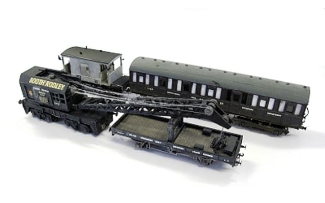 The 'Crane Train', at the back Airfix/Dapol brake van modelled as 'un-fitted' to the left of a modified Ian Kirk kit-built coach (part of a Quad set). Front left is an Airfix/Dapol bogie mounted crane with crane runner, modified Parkside plate wagon