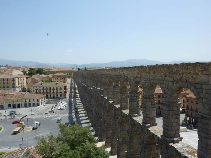 Aqueduct of Segovia: this ancient water channel cuts through the modern aspects of the city, perhaps representative of an age-old conflict splitting the consciousness of the current people