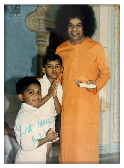 The little Krishna Rao standing next to Swami with his hands folded! Also in frame is Sai Kiran.