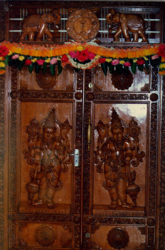 The interview room door which is next to the bhajan hall. Everyone sought for a chance to sit closest to this door for Swami would emerge from behind it!