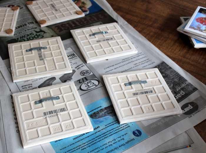 Attach sawtooth hangers to the back of ceramic tiles with E-6000 to hang them on the wall.