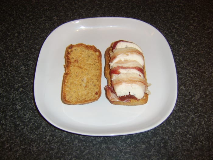 Chicken breast stuffed with sun dried tomatoes, wrapped in pancetta and served as a sandwich in a sun dried tomato ciabatta roll