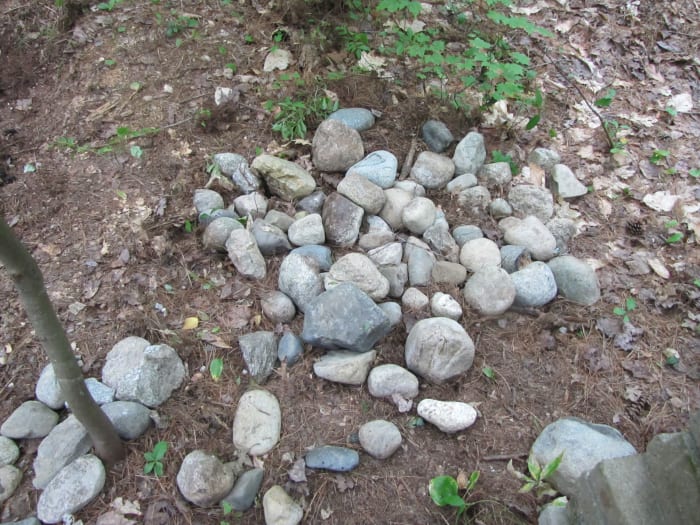 Accumulating the rocks - when I take my daily walk, I always bring back a rock or two that I find along the way.