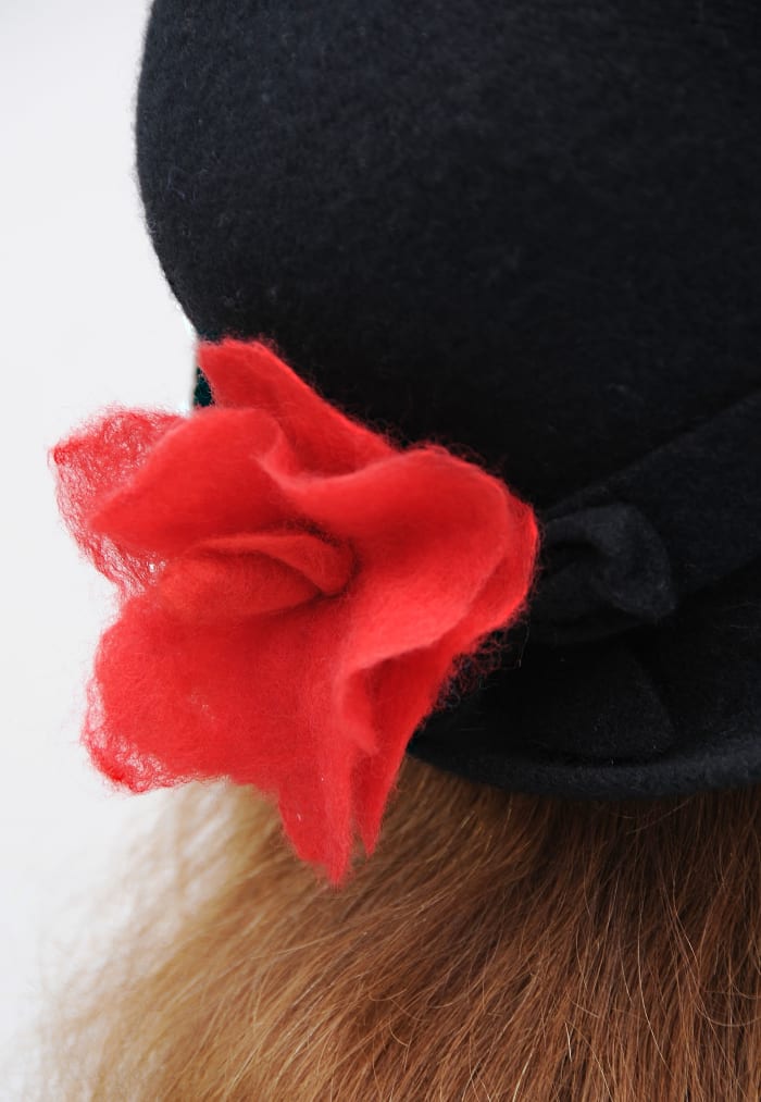 The rose is enhanced by the use of very fine layers of wool. Delicate Filigree Petals