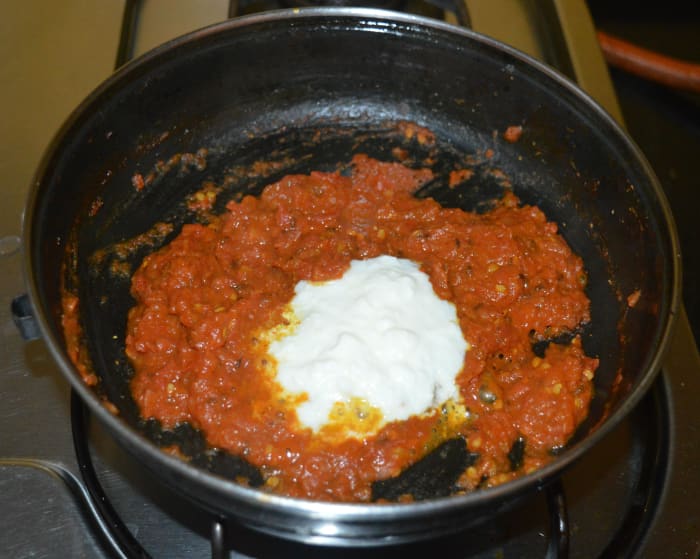 Step four: Add yogurt or thick curd. Saute for two more minutes or until the mixture loses moisture and becomes thick.