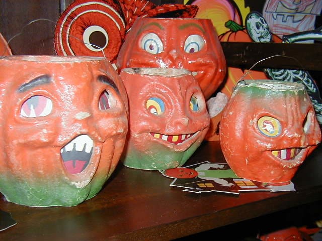 Whether those pumpkins are grinning or scary, they are amazingly expensive if they are not reproductions.