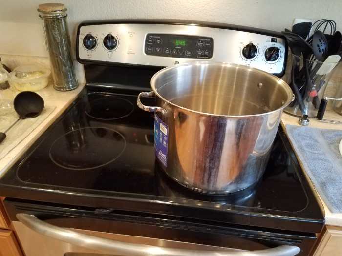 Step 2: I use my water bath canner to cook my pasta sauce and then wash it with soap and water before canning with it.