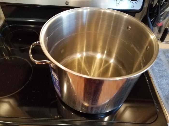 Step 3: Add about 1/4 cup of olive oil tot he bottom of your pot. It's important that's it's olive oil for the taste of your pasta sauce.