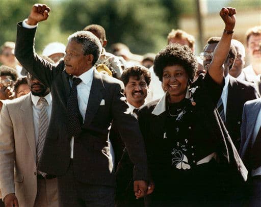 Sunday Feb. 11, 1990 file photo, Nelson Mandela and his then wife Winnie, walk hand in hand upon his release from Victor prison, Cape Town, South Africa.