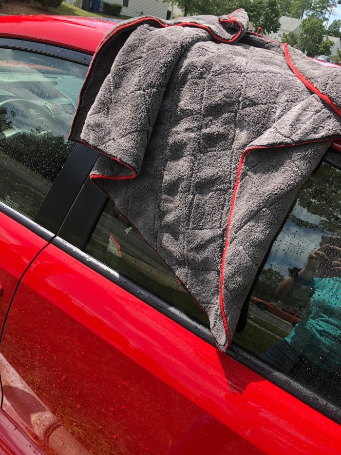 Once again, working quickly, use a couple microfibers to dry. You need to dry quickly to avoid water spots.