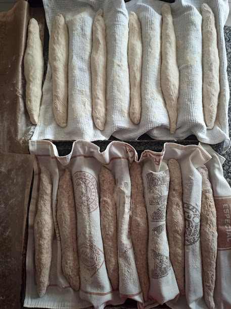 Place on a floured cloth, cover, and leave until doubled in size. Before baking, slash with a razor or very sharp knife, spray with water, and bake.