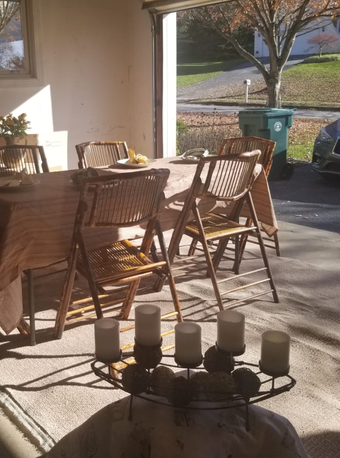 Here is one table in a garage that has been spruced up for garage dining during COVID-19. In a standard two-car garage, you can fit two or three tables.