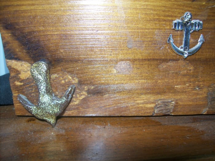 You can make anchors from bake-clay, also. For the application above, I coated the anchor with some glitter glue. The other anchor is a necklace charm.