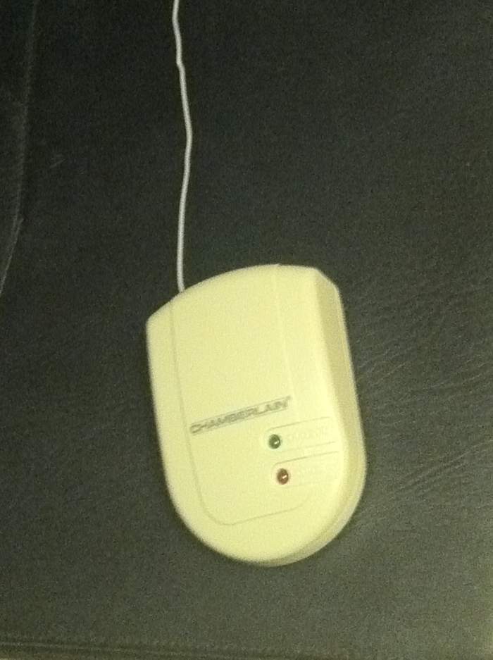 The indoor receiver is about the size of a single light switch plus an unobtrusive antenna that receives the signal from the garage door.