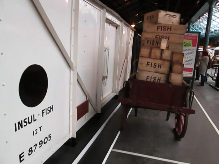 In a quiet corner of the NRM's Peter Allen building, a British Railways' built LNER designed fish van with the later 'Blue Spot' livery stands at the platform next to a trolley loaded with fish boxes