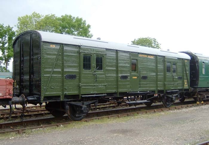 In Southern Railway green, preserved 4-wheeled Utility van seen on the Bluebell Railway in Sussex - often ran as passenger baggage vans on boat trains to the south coast,. some on Red Bank parcels trains as far afield as Darlington in late B R days