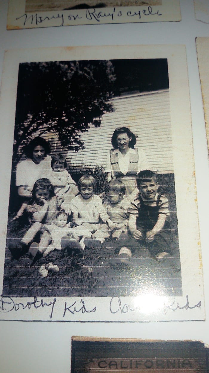 In back L to R: mom holding sister Beatrice and Aunt Sissy. In front L to R: cousin Carol, aunt Mary, cousin Larry, and author