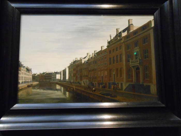 Painting of Old Amsterdam that is so clear in person it almost looks like a photograph.